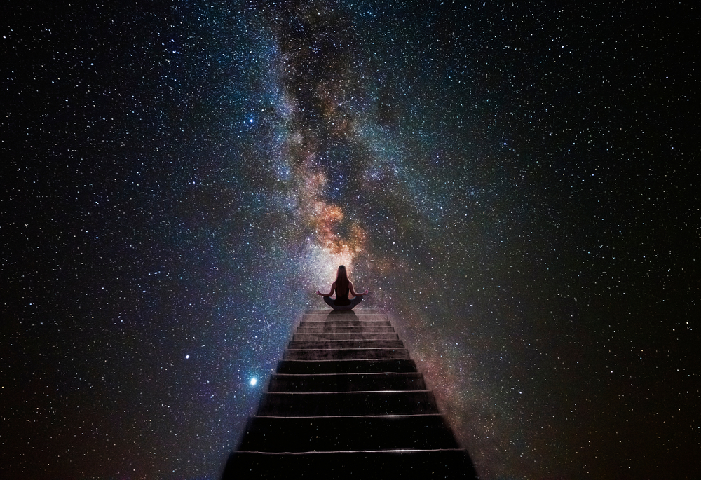 Woman in yoga pose at top of stair