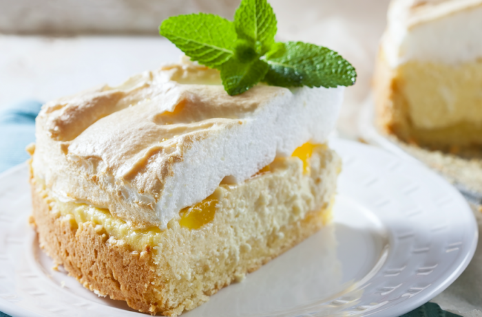 Dairy-free Lemon Meringue Cheesecake with garnish on a white plate