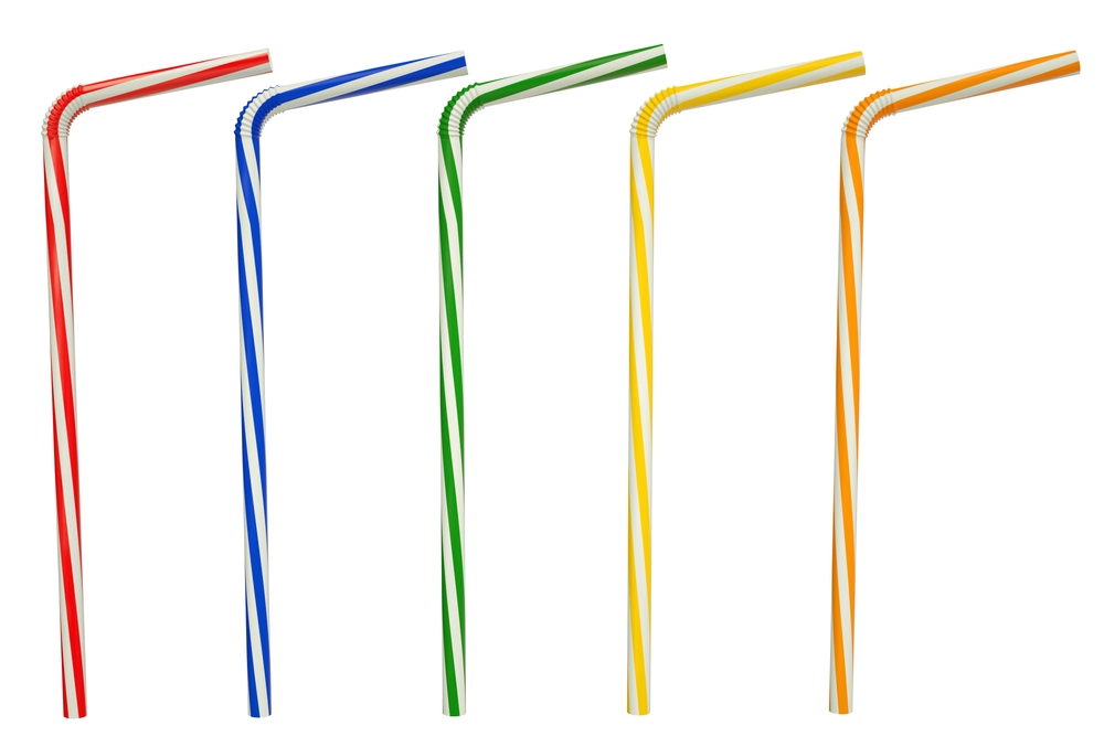 colorful plastic bendable drinking straws isolated on white background. red, blue, green, yellow and orange drinking straw. Flexible straws on white with clipping path.
