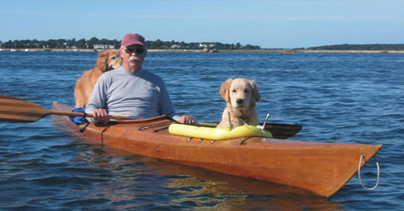 Man Builds a Custom Kayak with Pouches So He Could Take Safely His Dogs Out Into the Water