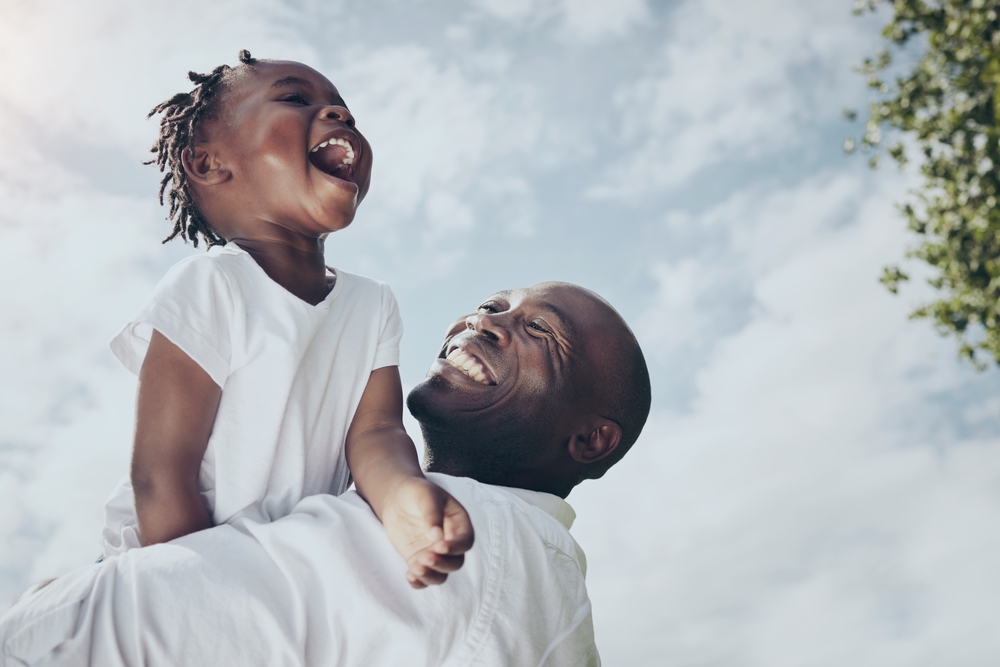 The sky is the limit. Shot of a young father and daughter spending time together outside.