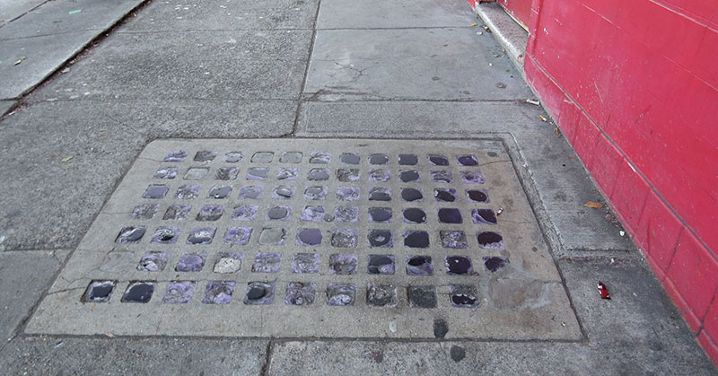 What Are Those Grids of Glass in the Sidewalk — And Why Are They Purple