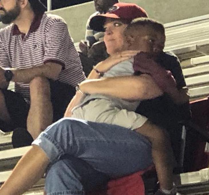 woman hugging child