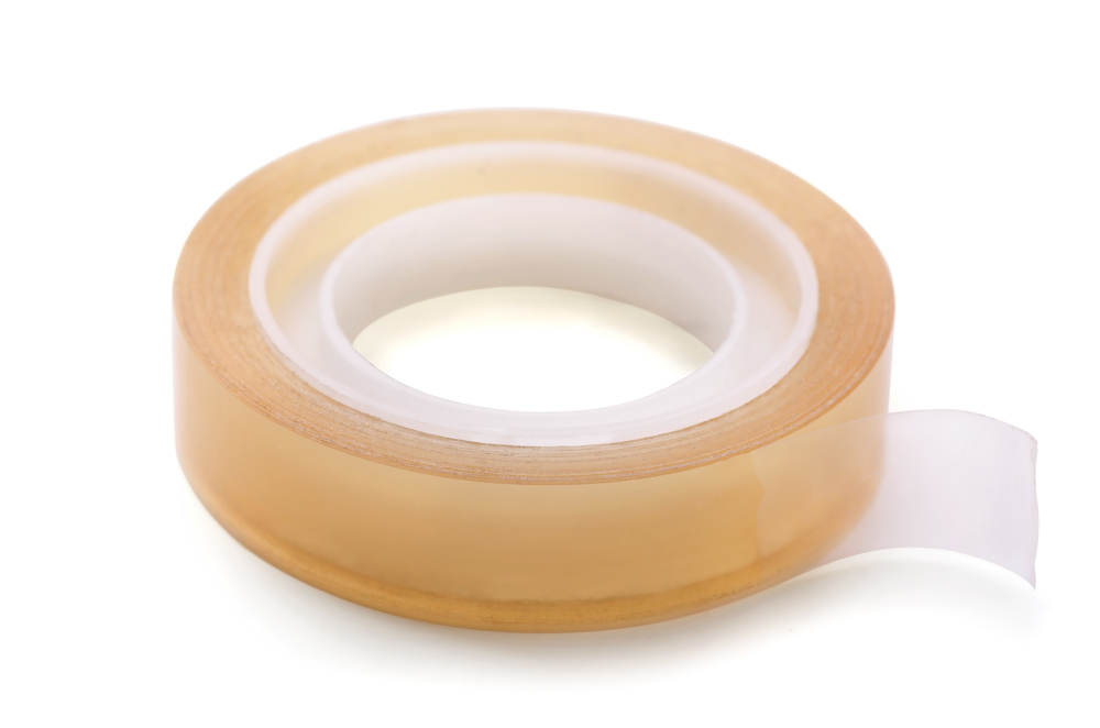 Roll of clear transparent sticky tape isolated on white
