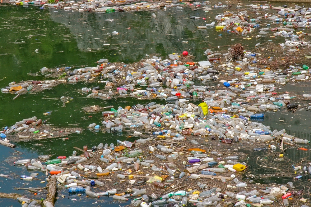 Pollution on the river with bottles
