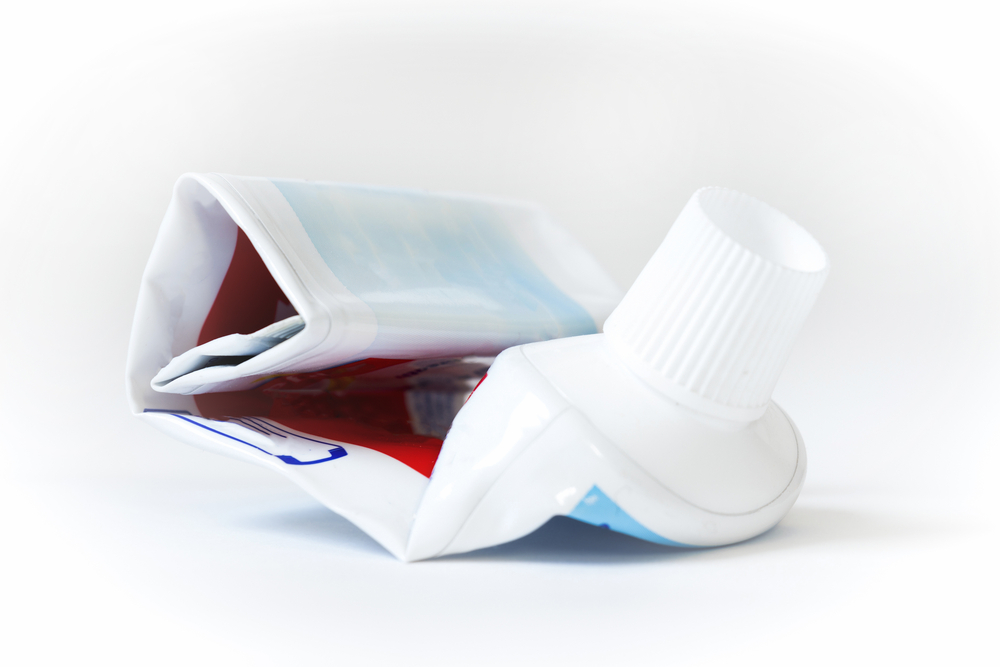The empty tube of toothpaste on a white background.
