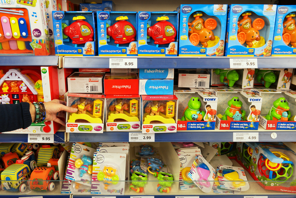 WOLVEGA, THE NETHERLANDS - DECEMBER 2, 2016: Toys from different brands in a toy store. Aisle with a variety of Toys in a Dutch Action Superstore.
