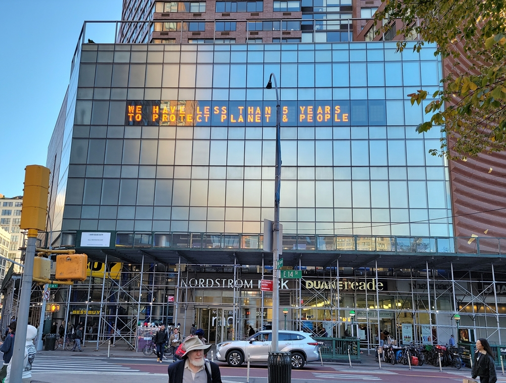 New York, NY, USA - 10-15-2024: Metronome, the Climate Clock, installed at 1 Union Square South on 14th Street building ten stories high. The NY clock that told time before, now tells the time remai
