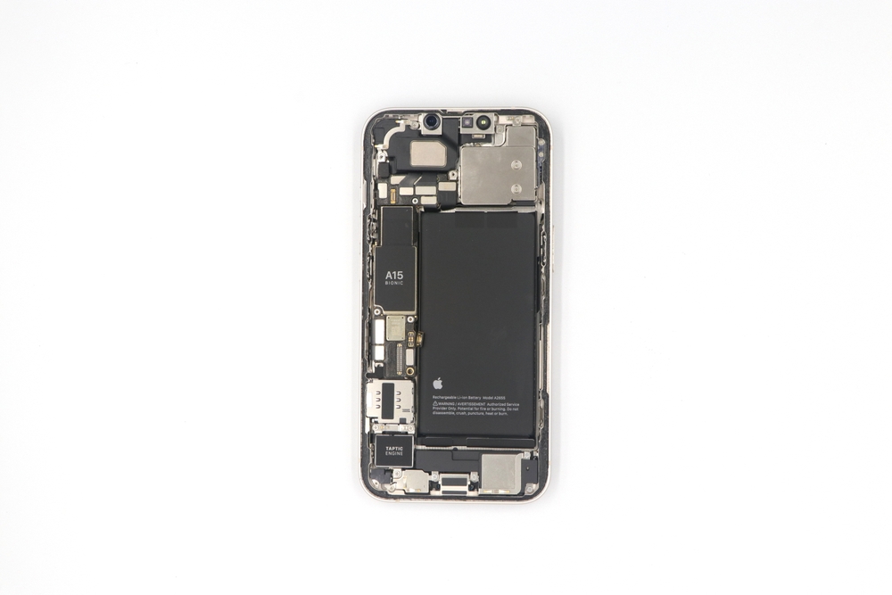 Bangkok Thailand.October 31 2022 Interior shot of iPhone 12 Pro with device, battery, board and key components on a white background.