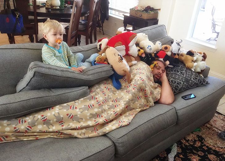 Building a fort on top of his dad