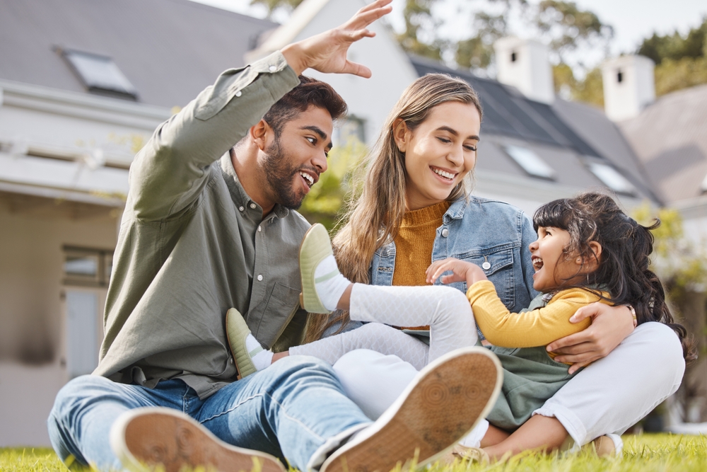 Fun, family and garden of new home with love, support and laughing with parents and kid. Backyard, smile and moving of mother, father and young girl together with bonding outdoor and real estate