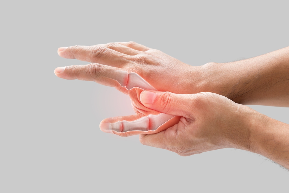A man has a sore palm because of inflammation of the finger bone.
