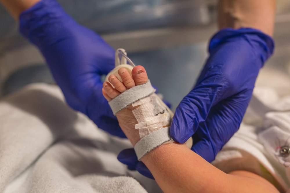Coronavirus. Covid-19.Doctor checking newborn baby. Vaccination virus. midwife giving antibiotics to newborn baby. Small baby having antibodies check. Newborn baby in hospital. Pandemic virus. Sepsis