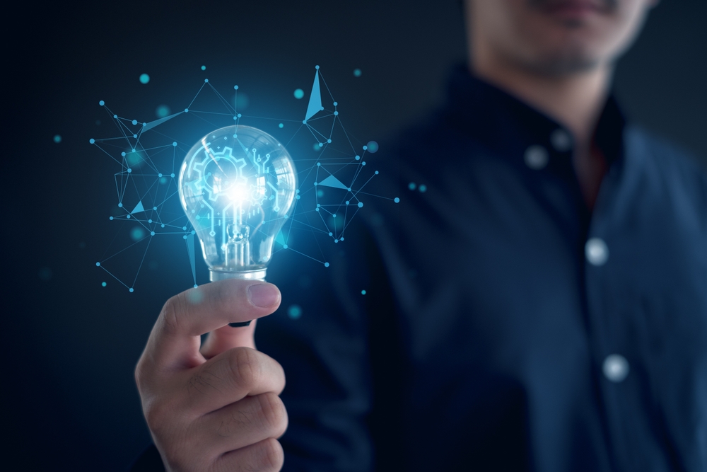 Idea innovation and inspiration concept.Hand of man holding illuminated light bulb, Idea innovation and inspiration concept. creativity with bulbs that shine glitter, Concept for success.