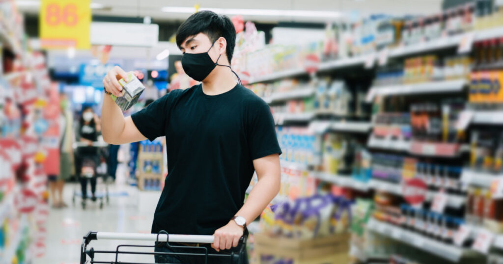 man reading food lable