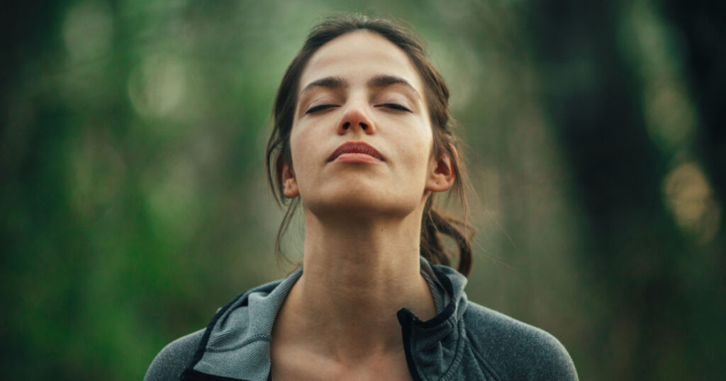 Young woman practicing breathing