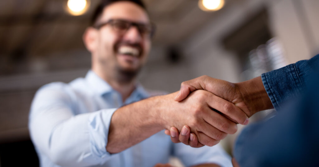 Business people shaking hands.