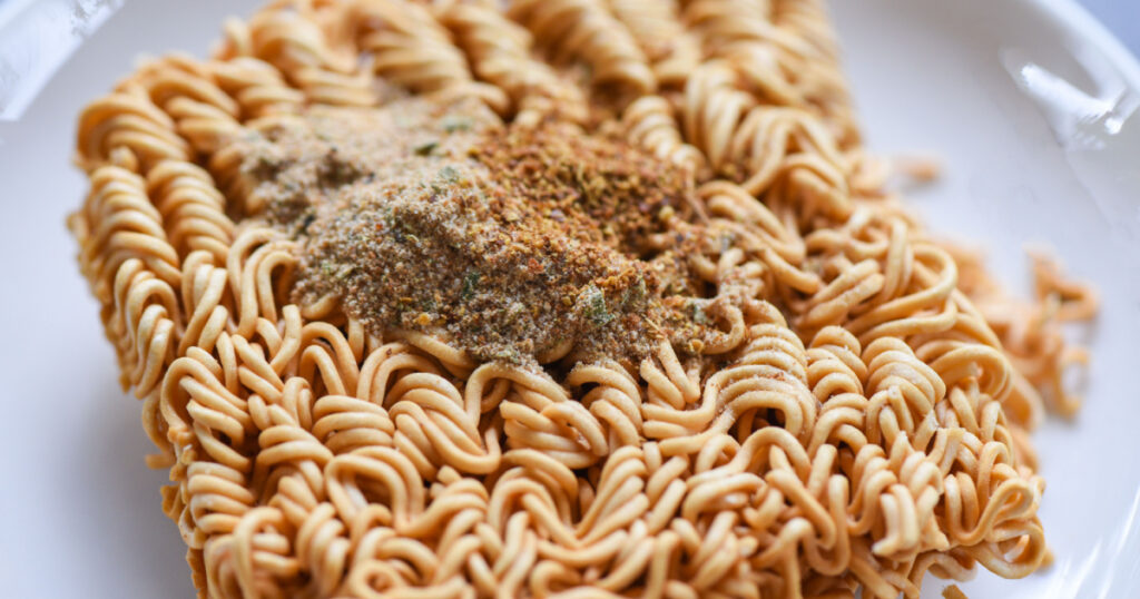 instant noodles on bowl with seasonings monosodium glutamate / Noodle thai junk food or fast food diet unhealthy eat msg concept , selective focus