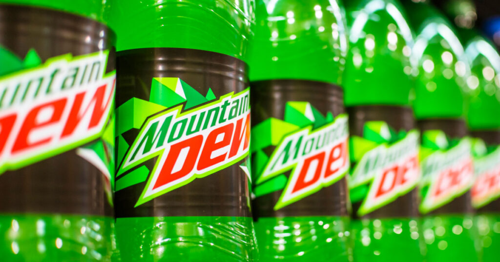 Manila, Philippines - July 2020: A row of Mountain Dew 1.5 Liter soda on display at an aisle in a supermarket.