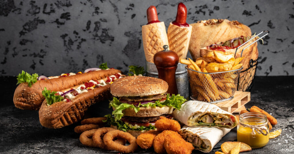 take away fast food products Kebab, pita, gyros, shaurma, wrap sandwich with french fries and nuggets meal, junk food and unhealthy food. banner, menu, recipe place for text.
