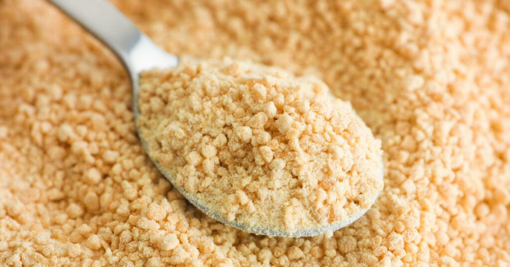 Soy lecithin in a tea spoon. Close up.