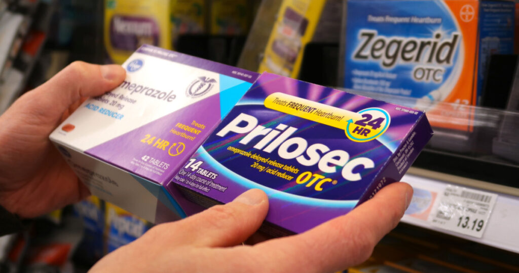 Longmont, CO USA - March 23, 2021: Deciding between a name brand or generic medication for heartburn, a burning pain in the chest caused by some foods. Common in evening.
