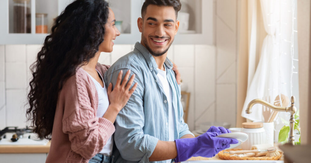 couple washing dishes