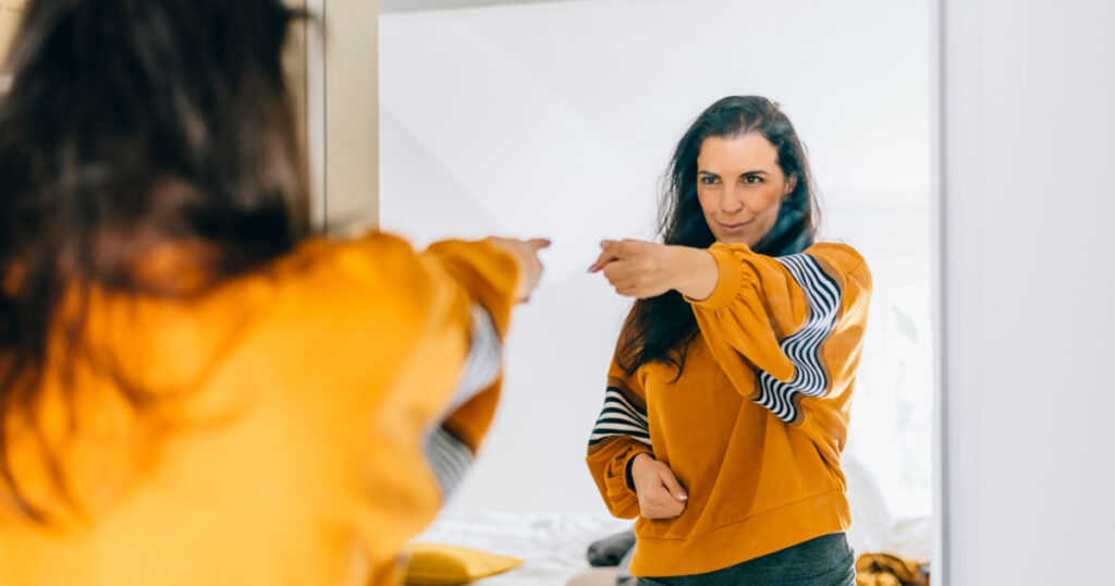 pointing at self in mirror