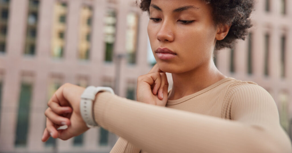 woman looking at watch