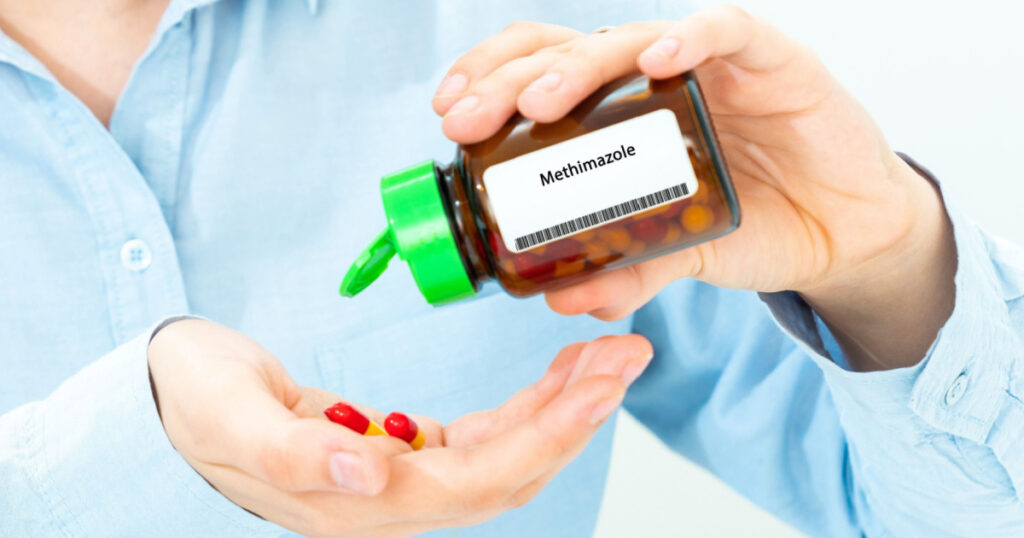 Methimazole Woman Hand holding on open palm with pill tablets medicine for healing
