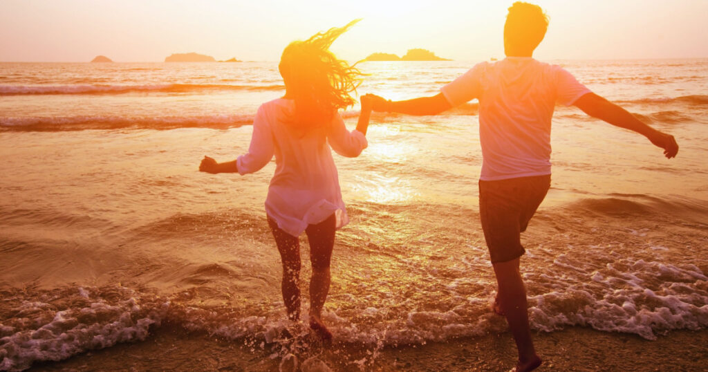 silhouette of couple on the beach, dream vacations