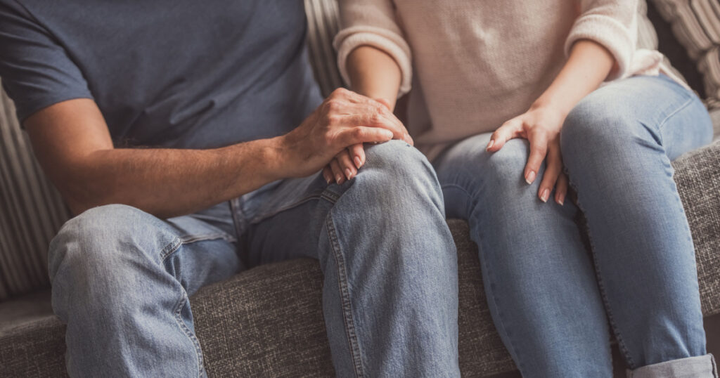 couple hands on knee