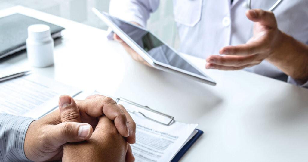 Doctor consulting with patient and checking sickness condition while presenting results diagnosis symptom examining about the problem of illness and recommend treatment method, Healthcare and medical.