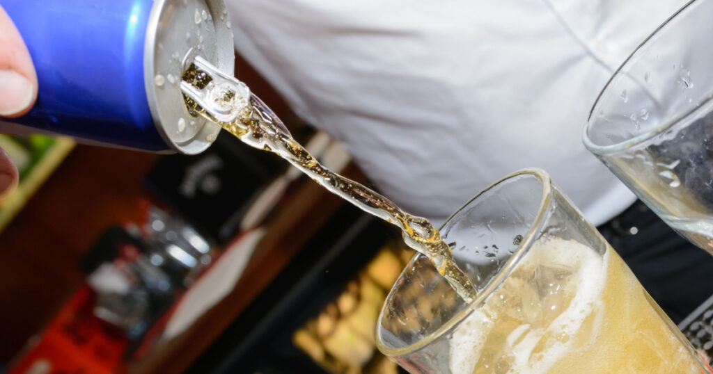 energy drink being poured into glass
