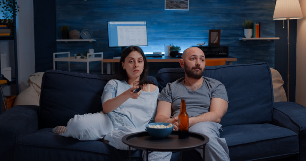 man and woamn on sofa