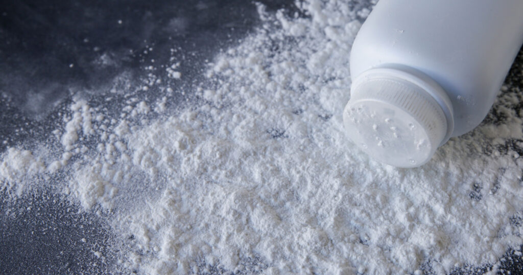 Talcum powder on black background
