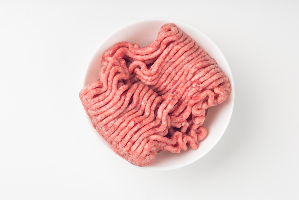 Close up on isolated bowl of lean red raw ground meat