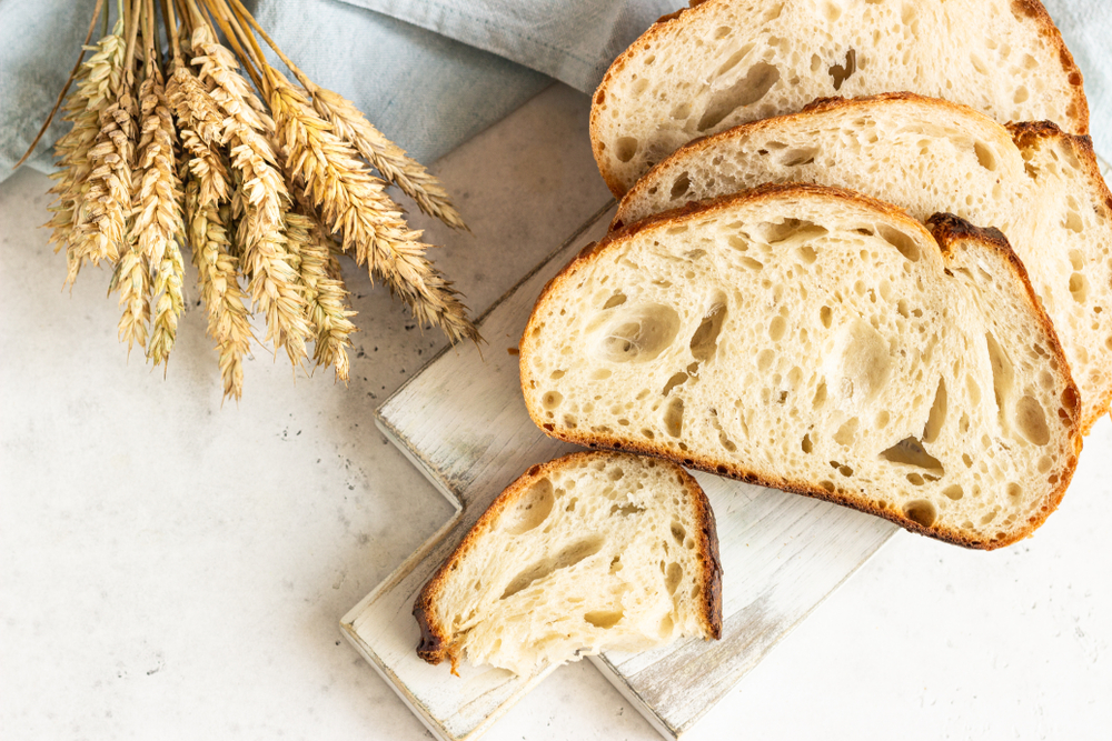 Freshly baked homemade artisan sourdough bread. Sliced. Top view. Copy space.