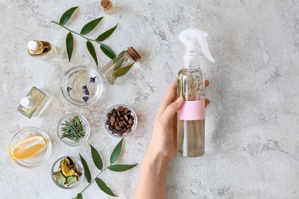 Woman with natural homemade air freshener at table