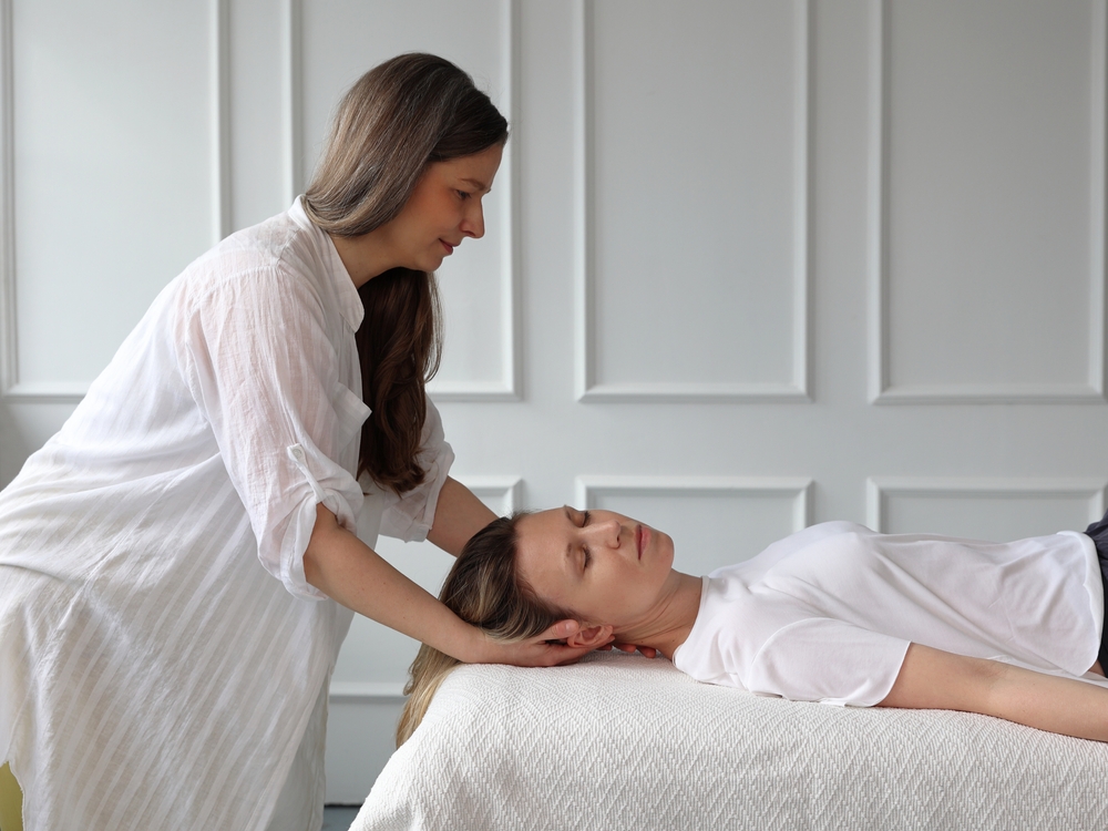 Patient and body work therapist . Neck Pain Relief, Posture Correction concept. Osteopathy, Alexander technique, Chiropractic session.
