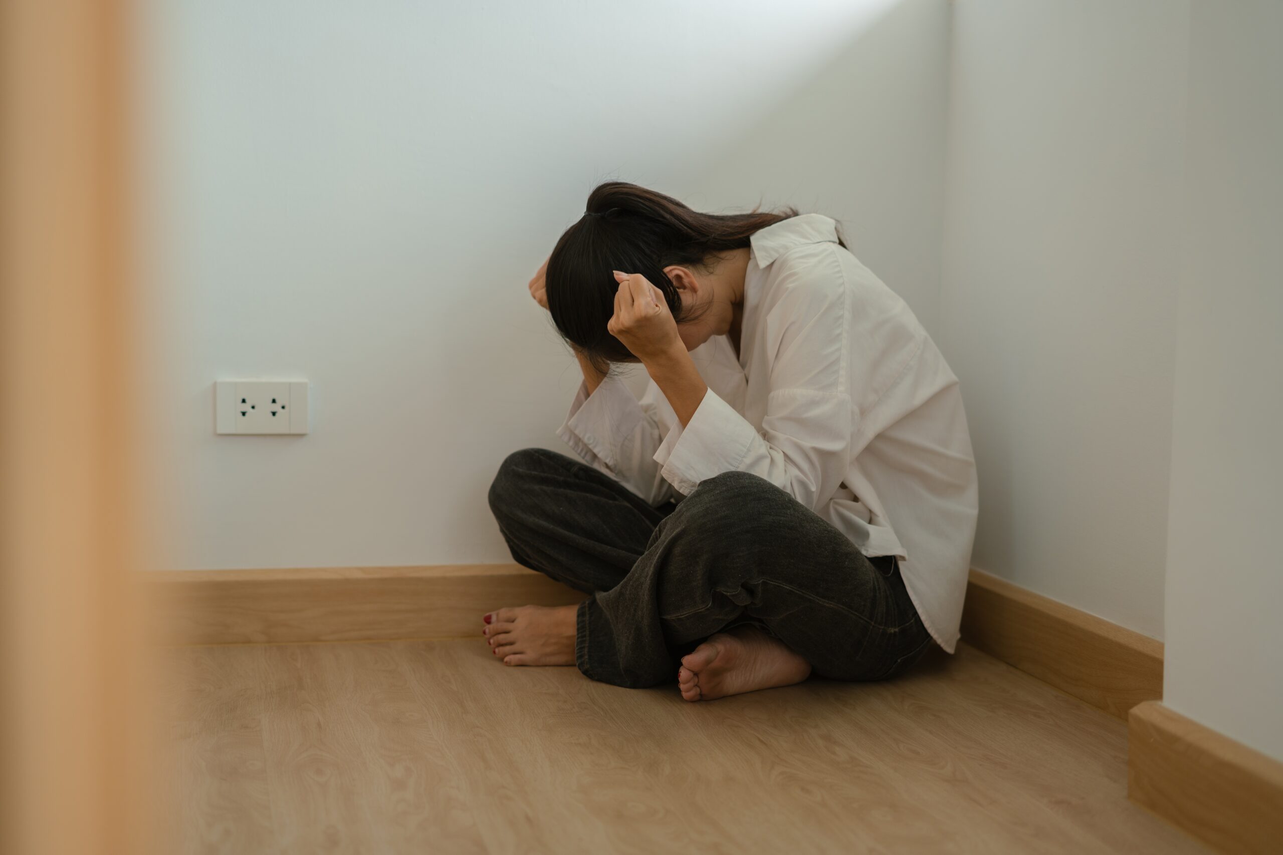 House debt bankrupt stress concept, Depressed Asian woman feeling tired, sad and unhappy.
