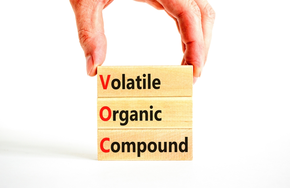 VOC volatile organic compound symbol. Concept words VOC volatile organic compound on beautiful wooden blocks. Beautiful white background. Business VOC volatile organic compound concept. Copy space.
