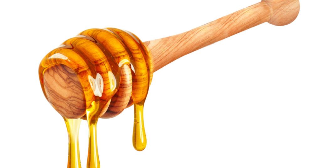 honey dripping isolated on white background