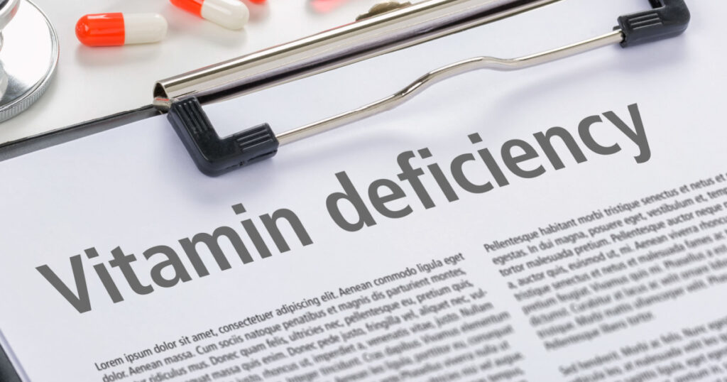 The diagnosis Vitamin deficiency written on a clipboard
