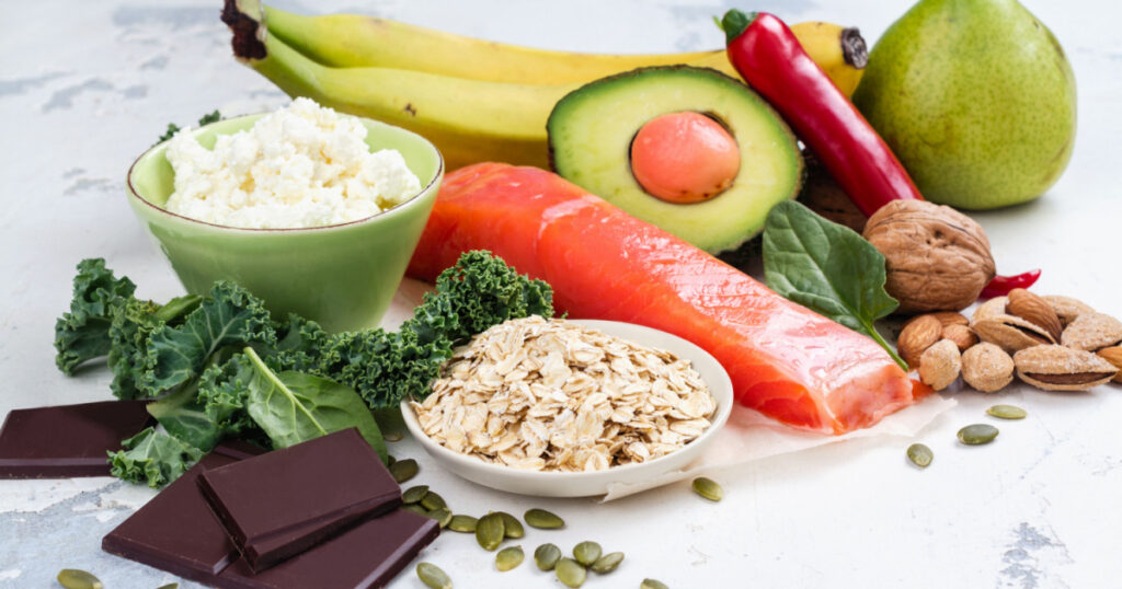 Assortment of food - natural sources of dopamine. Food good for brain on white background. Copy space