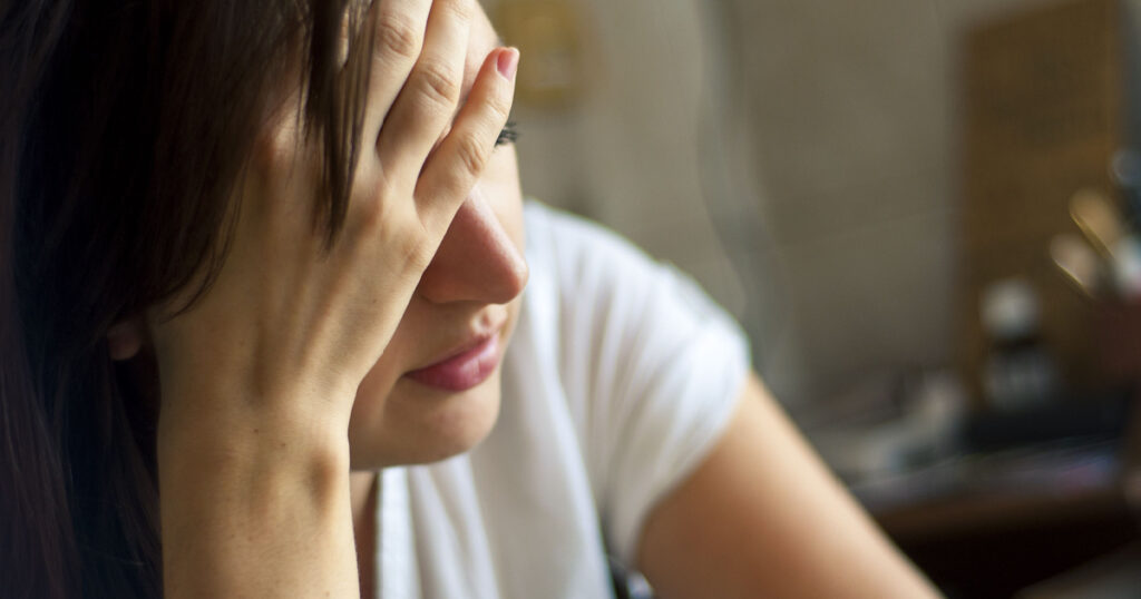 An image of girl with headache
