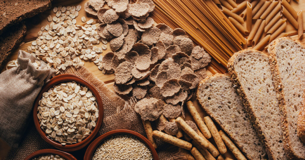 Wooden table full of fiber-rich whole foods, perfect for a balanced diet
