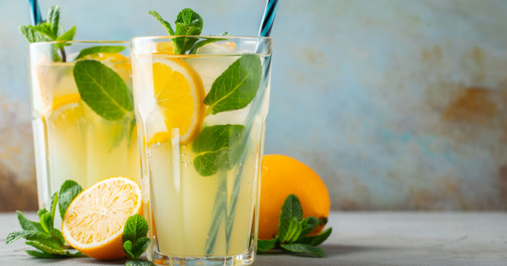 Two glass with lemonade or mojito cocktail. With copy space.