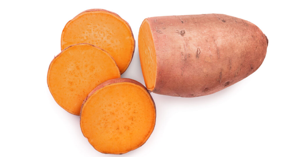 Sweet potato isolated on white background closeup. Top view. Flat lay.