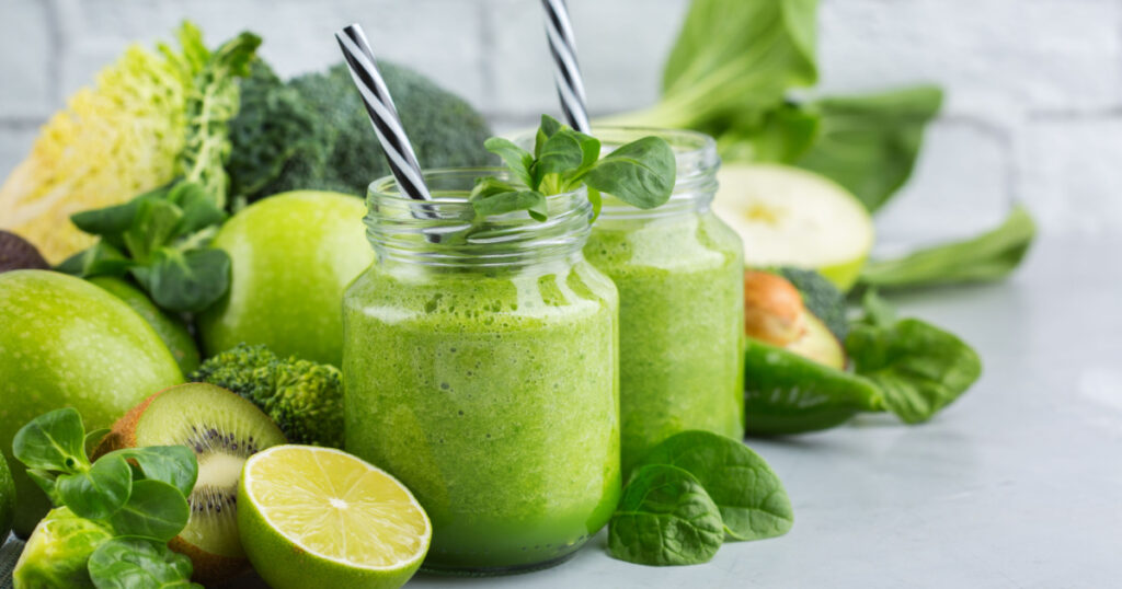 Food and drink, healthy dieting and nutrition, lifestyle, vegan, alkaline, vegetarian concept. Green smoothie with organic ingredients, vegetables on a modern kitchen table